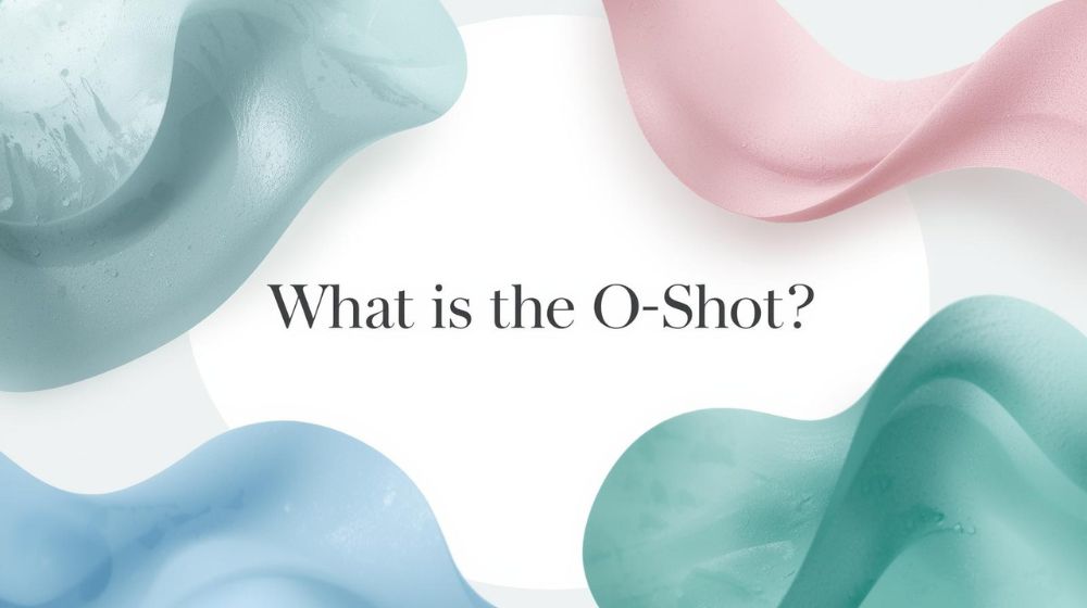 A minimalist promotional graphic with soft, flowing pastel waves in shades of light blue, mint green, and blush pink forming an incomplete circle on a white background. Centered in bold black serif text reads: “What is the O-Shot?”